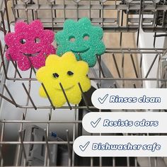 four donuts with different colors and shapes in a dishwasher basket that says, rinses clean resists odors dishwasher safe