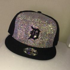 This listing is for one Crystal hat. If hat is a major sports team, the hat used will be licensed.  Any special stone colors or personalization is to be made clear in a message after purchase-- otherwise the hat will be blinged at the artist discretion.  The front of hat will only have crystals (see photo for sample) *If you want a fully blinged hat message me for a custom listing  ** Any questions feel free to message me first, and I will gladly answer any question with detail. Thank you Custom Flat Brim Baseball Cap, Crystal Hat, Bling Hat, Custom Bling, Hat Custom, Real Diamonds, Bling Bling, Trucker Cap, Sports Team