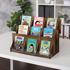 there are many books in the wooden holder