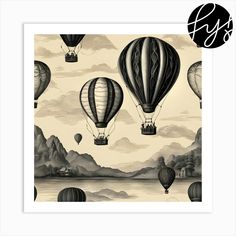 hot air balloons flying in the sky over water with mountains and clouds behind them, black and white