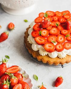 there is a cake with strawberries on it