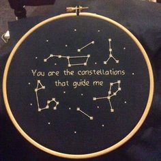 a cross stitch hoop with the words you are the constellations that guide me