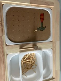 an image of a wooden toy set with some food in it's trays