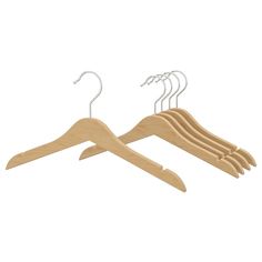 three wooden hangers with white clips on the top and bottom, each holding different sized clothes