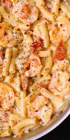 pasta with shrimp and tomato sauce in a pan