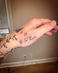 a person's arm with tattoos on it and the words, let them fly