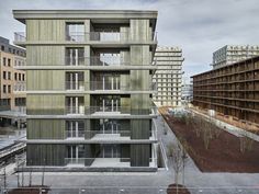 an apartment building with balconies on the second floor