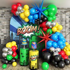 a room with balloons and heliums in the shape of boom signs, stars, and fireworks