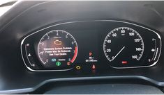 the dashboard of a car with two speedometers