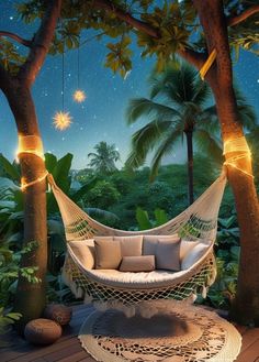 a white hammock hanging between two trees in the night sky with stars above it