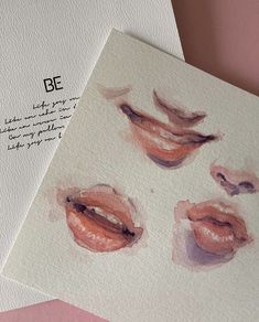 two cards with watercolor drawings of lips on them