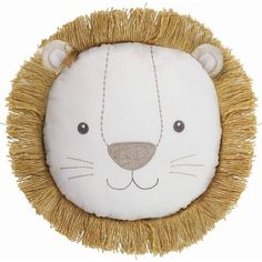 a white and gold lion head pillow on a white background with fringes around it