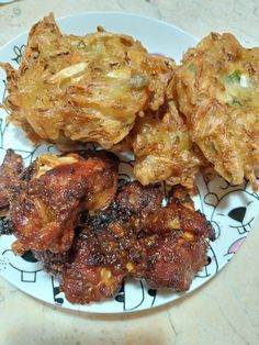 some fried food is sitting on a plate