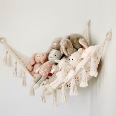 a hammock filled with stuffed animals hanging from it's sides