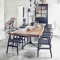 a dining room table with chairs around it