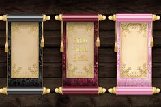 three different colored frames with gold, pink and black trims on wood planks