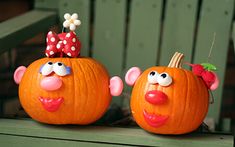 two pumpkins decorated to look like cartoon characters