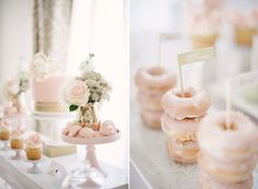 a table topped with lots of pink and white desserts