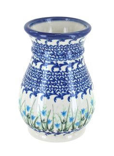 a blue and white vase with flowers on it