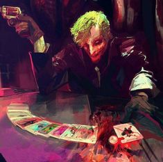 the joker is sitting at a table with cards