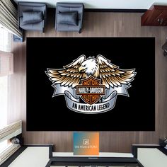 the harley davidson logo is displayed on a wall in an office area with two chairs