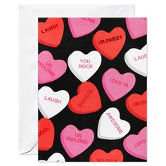 valentine's day greeting card with conversation hearts on black and pink background, which says you rock