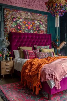 a bedroom decorated in pink and green with an ornate headboard, bedding, rugs, and lamps hanging from the ceiling