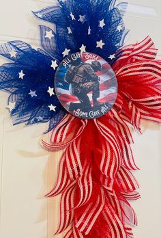 a patriotic wreath with an image of a soldier on it