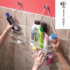 a person is holding onto a shower caddy with several items in it and one hand on the soap dispenser