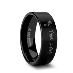 a black wedding band with the words i love you in white lettering on it and an inscription