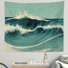 an ocean wave tapestry hanging on the wall above a bed in a room with a bicycle