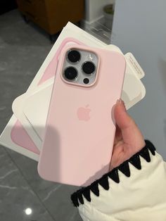 a person holding an iphone case in their hand