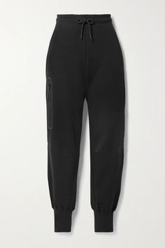 Nike's cotton-blend jersey track pants are backed in warm fleece, so they'll keep you cozy on chilly days. They have a flexible drawstring waistband and zipped pocket at the side to keep your phone and cardholder secure. Wear them with a hoodie and sneakers.Wear it with: [Nike Top id1254324], [Nike Sneakers id1187340], [Alexander Wang Tote id1254775]. Jean Trench Coat, Nike Top, Nike Sports, Nike Sneakers, Nike Outfits, Clothes Collection, Sport Pants, Black Media, Nike Tops