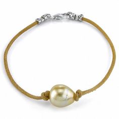 Sophisticated and stylish, this pearl bracelet is an eye-catching addition to your casual looks. Expertly designed, this rustic style features a single 11.0mm baroque-shaped golden cultured South Sea pearl centered along a leather cord. Buffed to a brilliant luster, this 7.5-inch bracelet secures with a sterling silver lobster claw clasp. Baroque Pearls Jewelry, Leather Bangle, Golden Jewelry, White Bracelets, Pearl Leather, Sea Pearl, Local Jewelry, Ring Minimalist, Childrens Jewelry