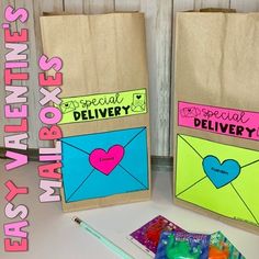 two brown paper bags with valentine's day messages on them next to some candy