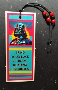 a bookmark with a star wars quote on it and a string attached to it