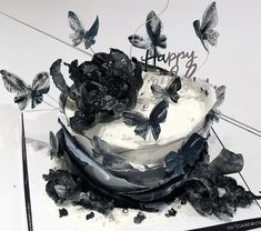 a birthday cake with butterflies on it