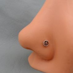 a close up of a fake breast with a peace sign on it's side