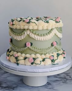 a three tiered cake with flowers on it