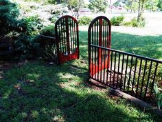 there are two wooden gates in the grass