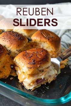 several sliders in a glass dish with text overlay that reads reuben sliders