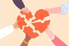 several people holding hands over a puzzle piece in the shape of a heart with one hand on another's shoulder