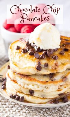 chocolate chip pancakes with ice cream on top and strawberries in the background text reads chocolate chip pancakes