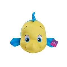 a yellow stuffed animal with blue eyes and a tag on it's ear, sitting in front of a white background