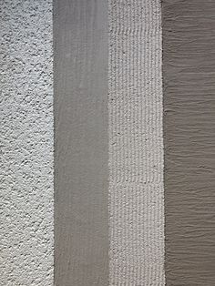 three different colors of paint on the wall and one is white, gray, and yellow