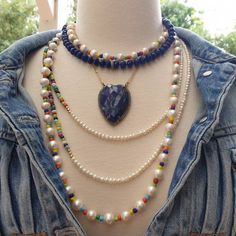 "Bright, vibrant beads make this necklace perfect addition to your summer sundress or a white blouse. African glass beads and 4mm white freshwater pearls are beaded to create a color block strand. You can wear this necklace single, double or even triple! Alone or layered with your favorites, this necklace exudes a playful, eclectic bohemian elegance. Necklace: 49\" plus extender Layer this necklace with: https://www.etsy.com/listing/637252353/baroque-pearl-and-turquoise-necklace?ref=shop_home_ac Bohemian White Crystal Necklaces With Round Beads, Round Bead Pearl Necklace For The Beach, White Single Strand Beaded Necklace For Festival, Beach Pearl Necklace With Round Beads, Bohemian Beaded Pearl Necklace For Vacation, Pearl Necklace With Round Beads For Beach, Summer Pearl Beaded Necklaces, Bohemian Blue Necklace With Pearl Chain, Pearl Beaded Necklaces For Summer