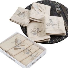 four linen napkins with embroidered utensils on them