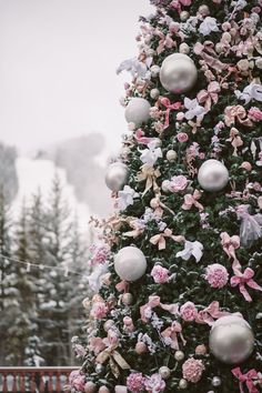 a christmas tree decorated with pink and white ornaments