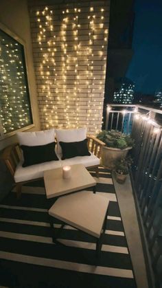 the balcony is decorated with lights and furniture