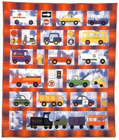 a quilt with cars and trucks on it